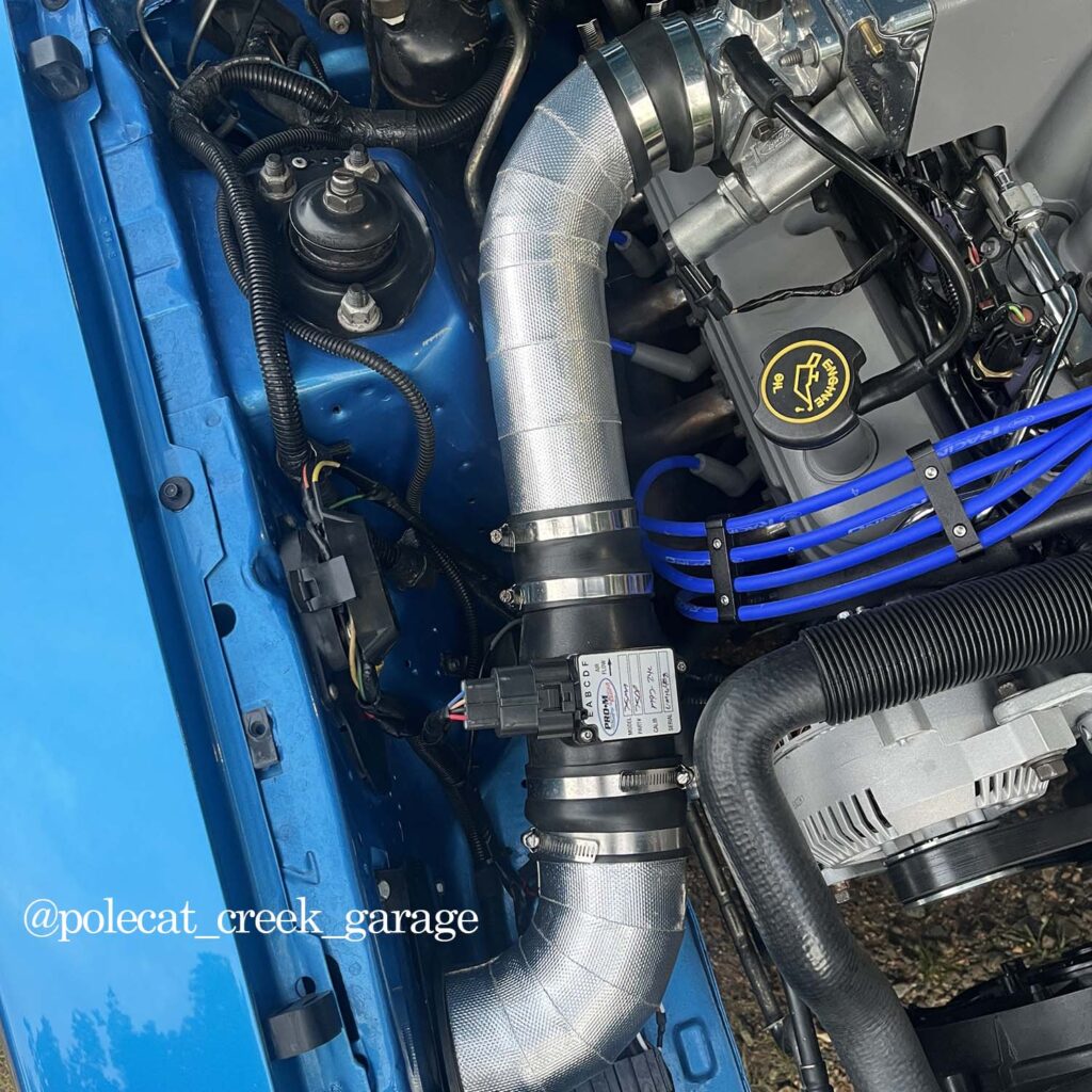 Heatshield Products Thermaflect Tape applied to intake tubing for lower air temps and improved performance.