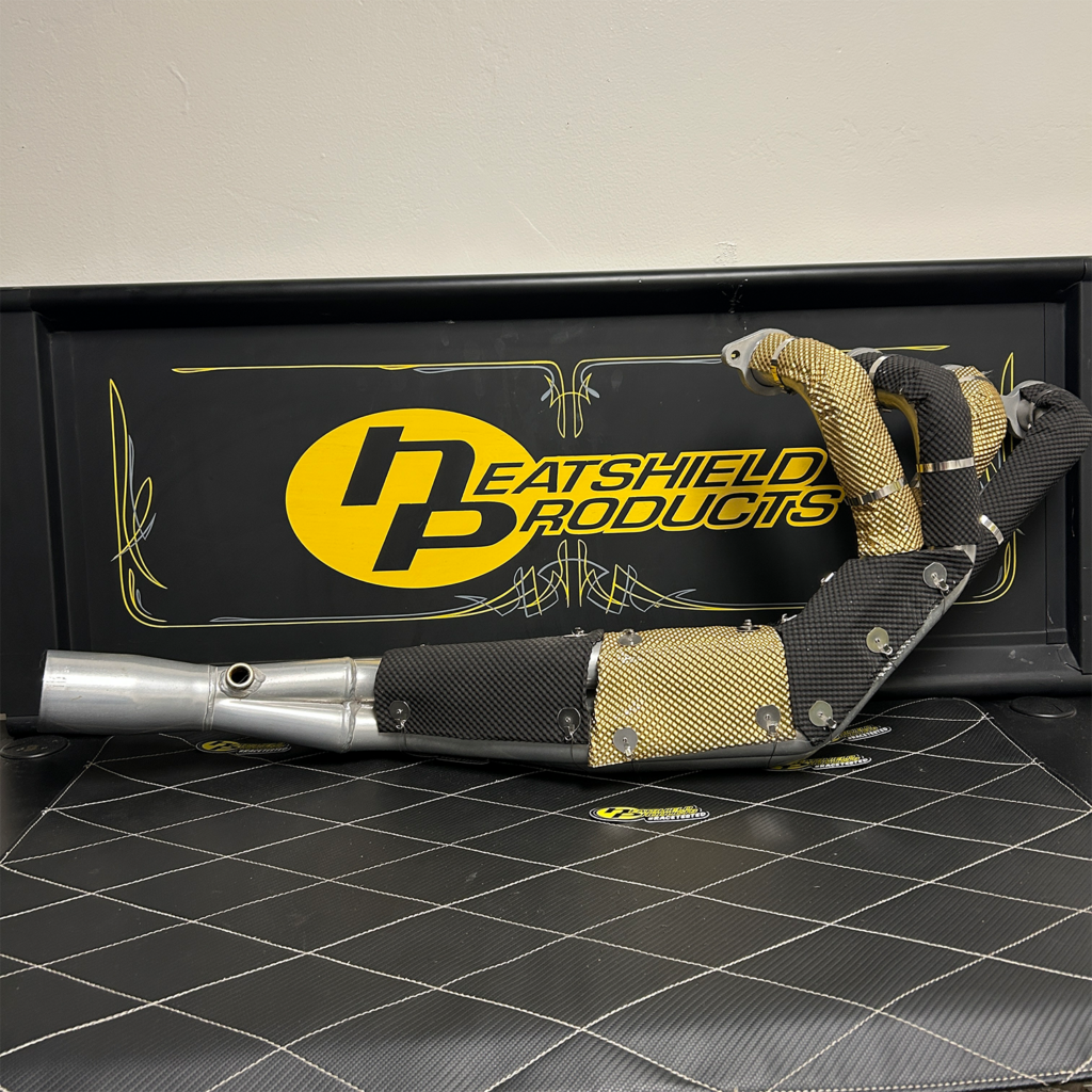 Heatshield-wrapped automotive performance header with fiber insulation gold and black