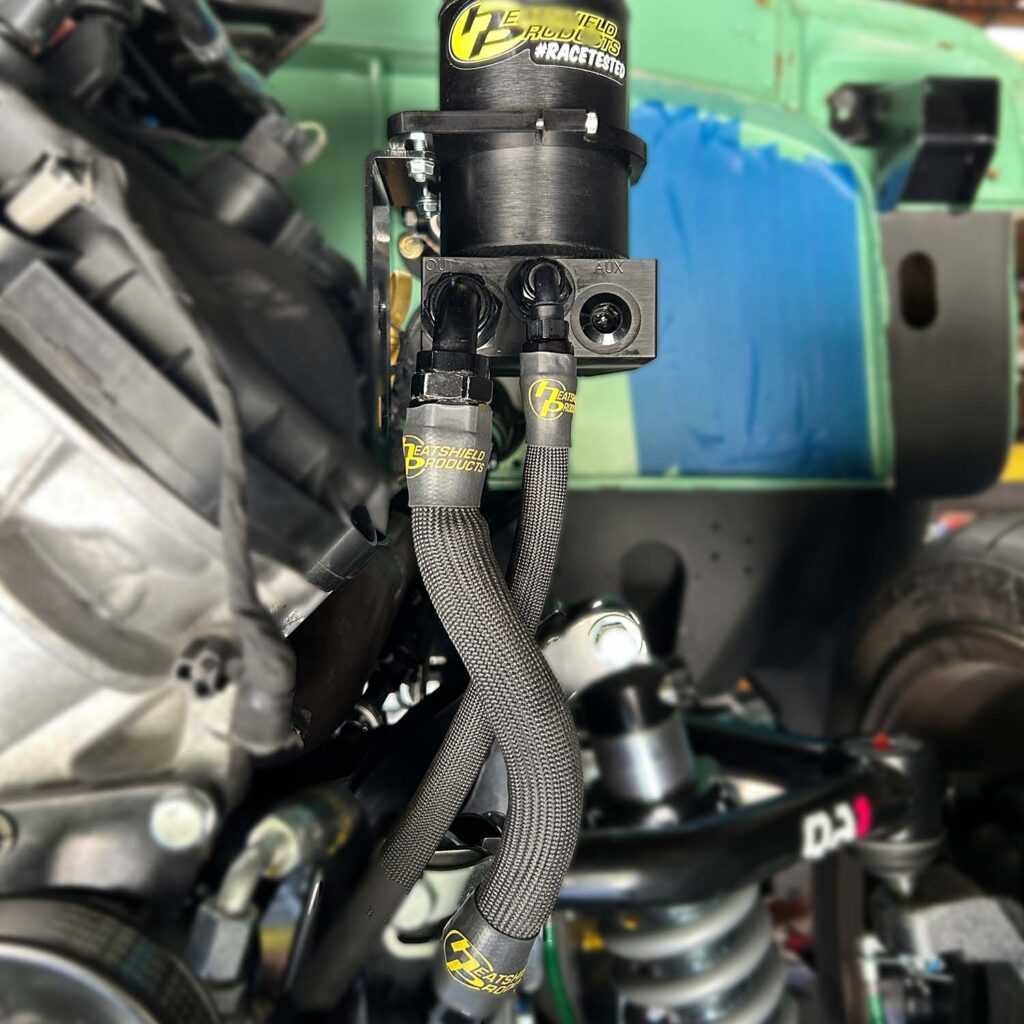 Heatshield Products Hot Rod Sleeve protecting power steering hoses on a Coyote-swapped 1967 Ford F100.