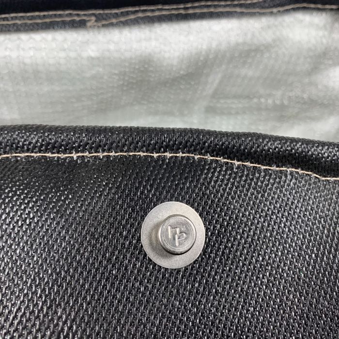 button head rivet on black exhaust jacket