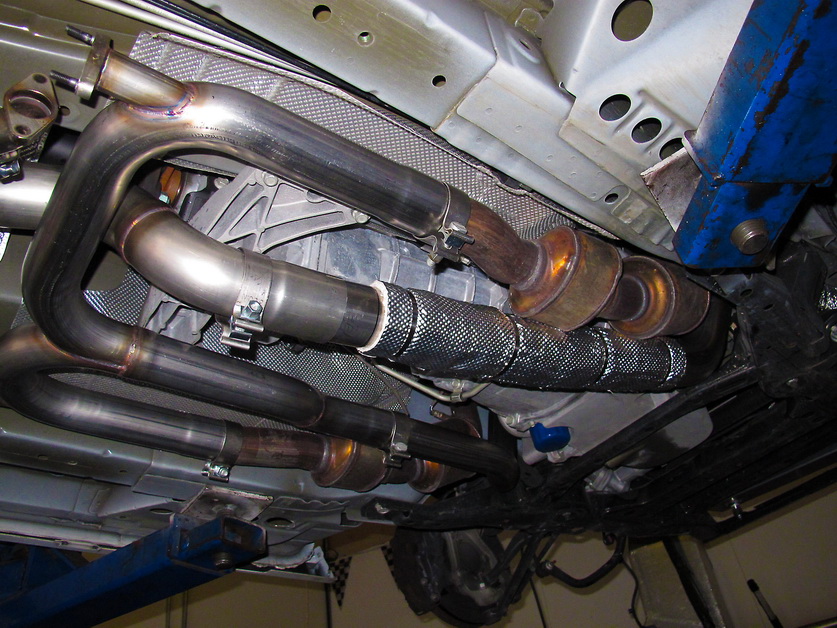 Heatshield product installed on car piping to increase turbo performance.
