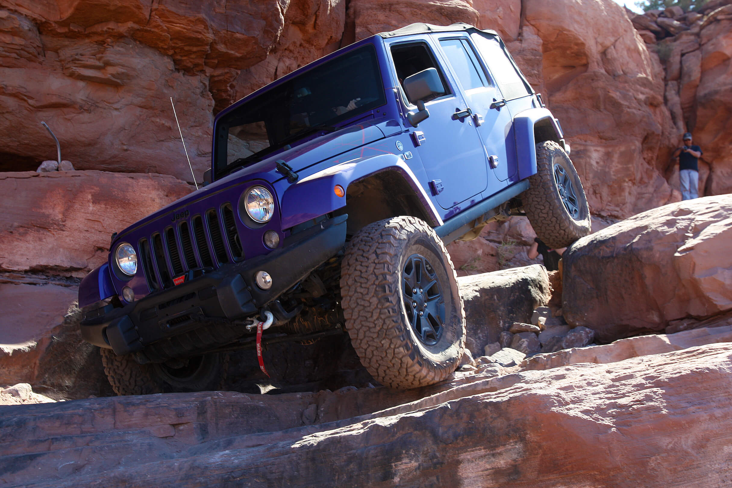 Blue Jeep Off Roads Down Canyon Rock 