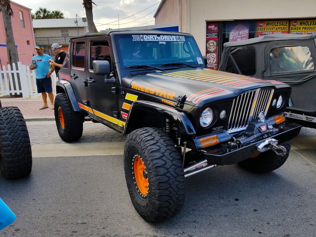 Black Jeep with Orange and Red Graphics