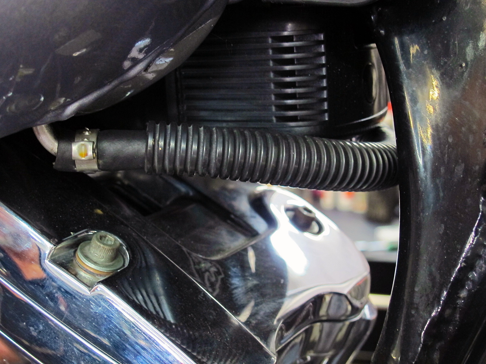 Motorcycle heat protection product installed on motorcycle piping.