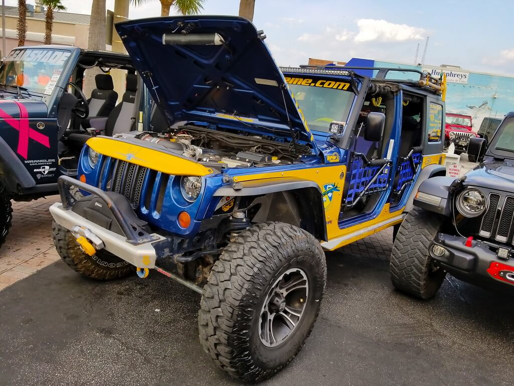 Bright Blue and Yellow Jeep with the Hood Up