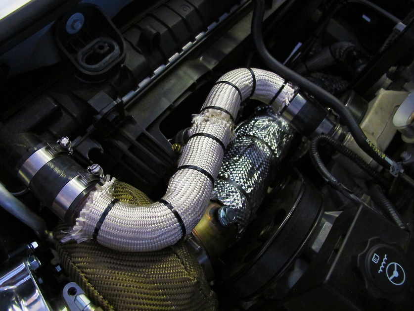 Heatshield product installed on car engine to increase turbo performance.