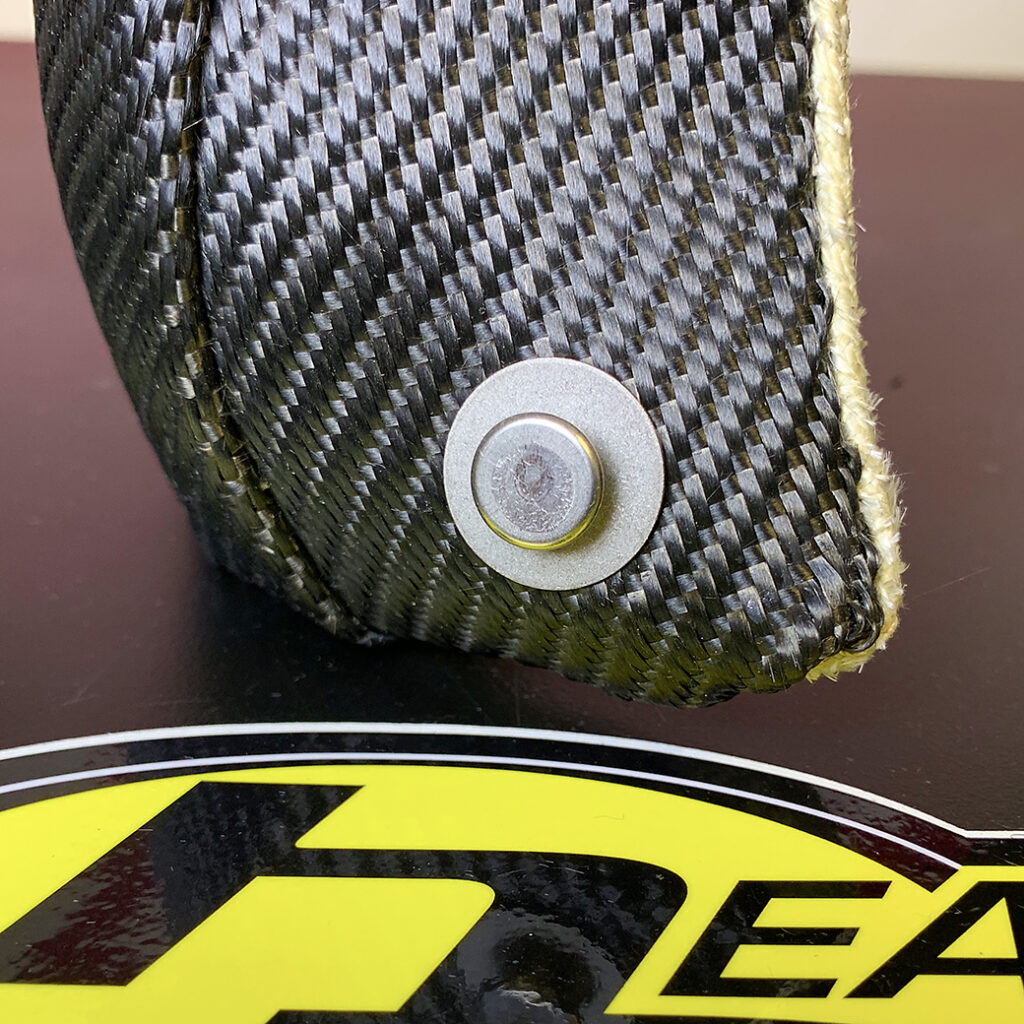 Button rivet on turbo blanket