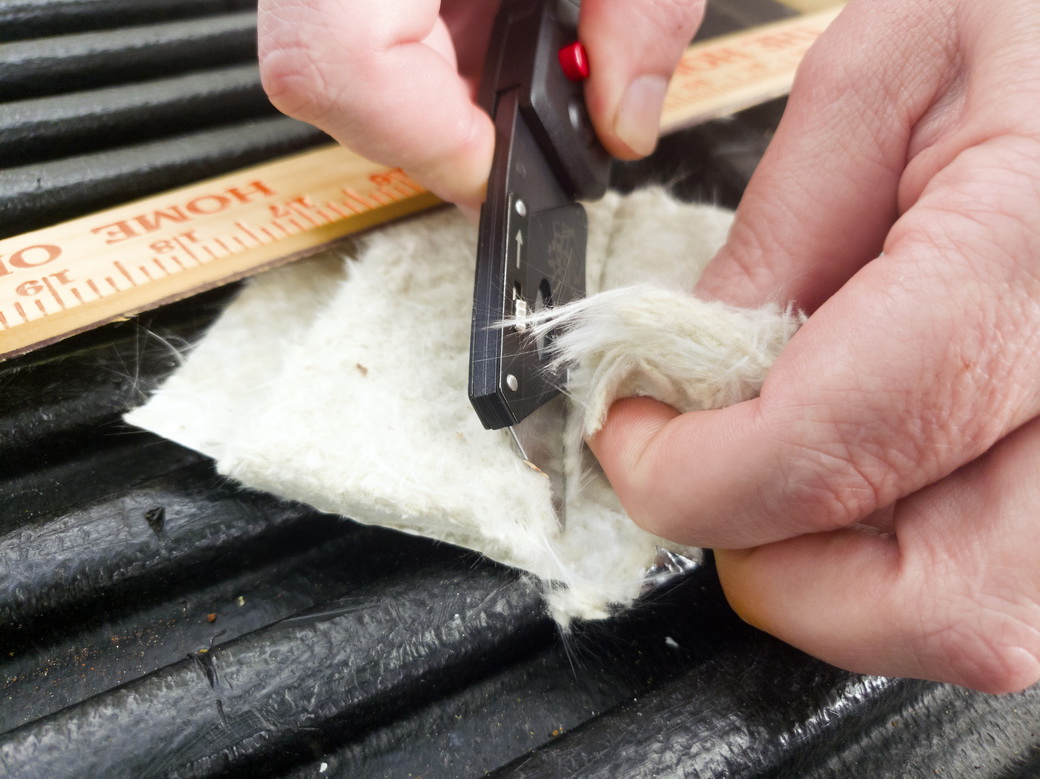 Peeling away Heatshield Armor insulation material