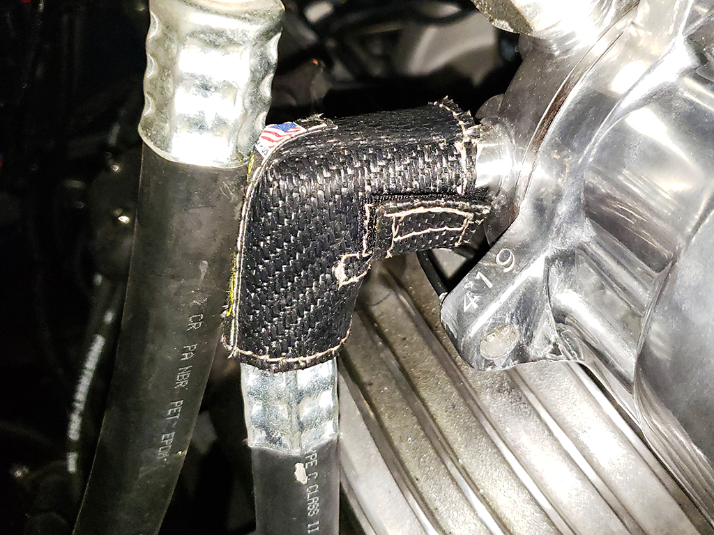 Utili-Shield installed on a 90-degree air conditioning line fitting