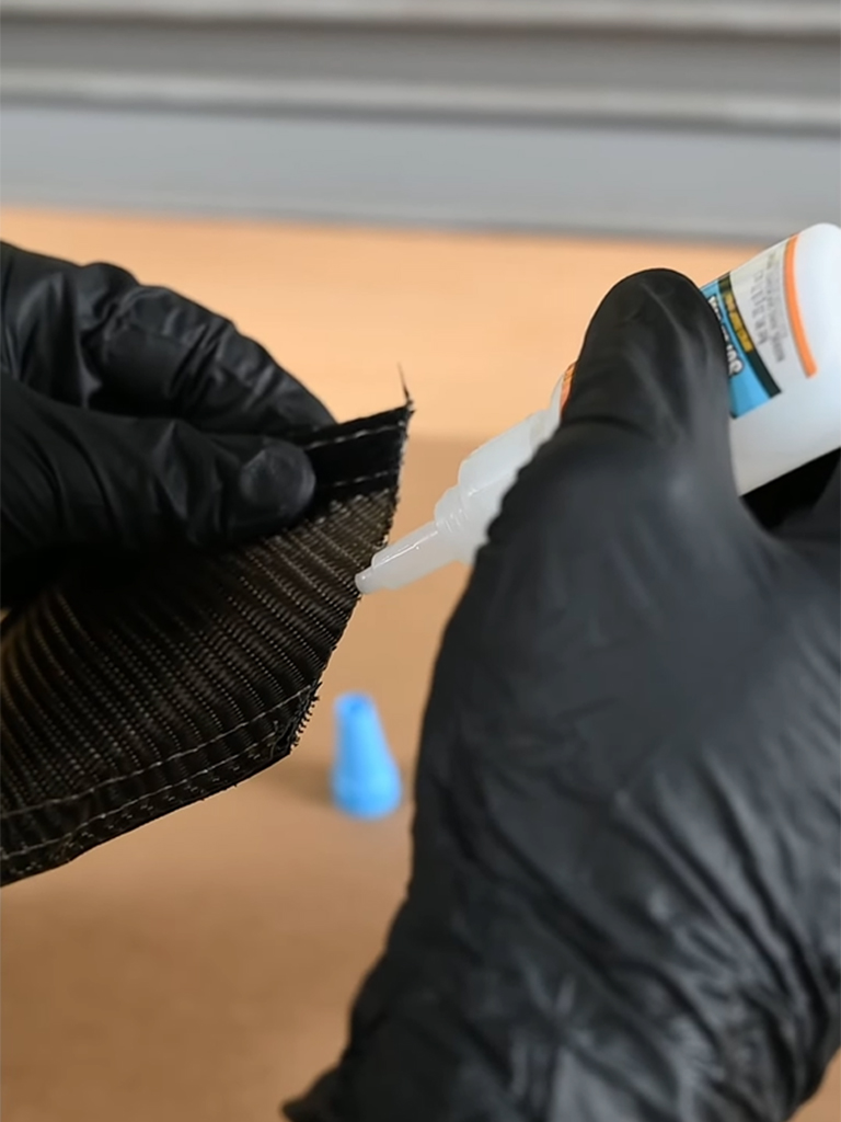 Applying super glue to the cut end of Lava Tube to prevent fraying