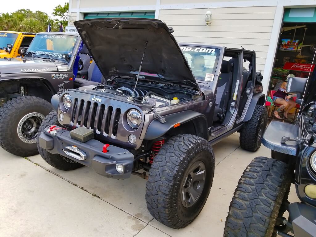 Black Jeep with it's Hood Popped