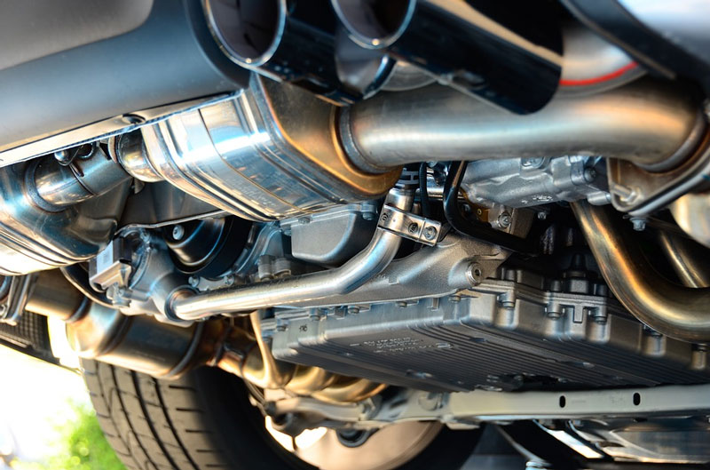 The underside of a Porsche exhaust system