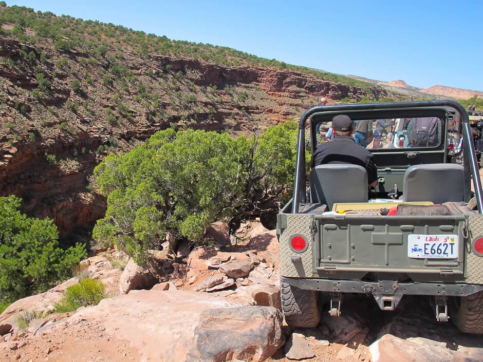 Green Jeep on Red Desert Canyon Path 