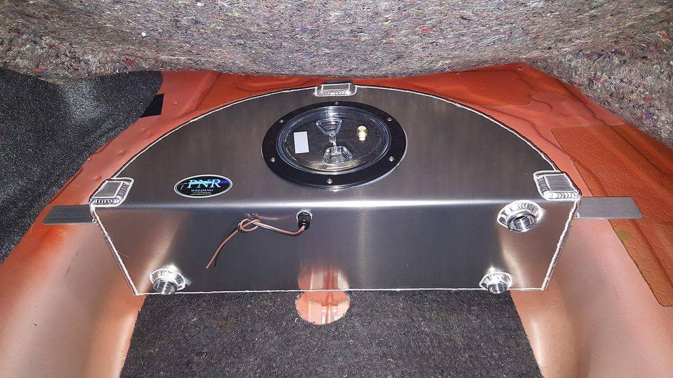 A custom intercooler is installed into a car.
