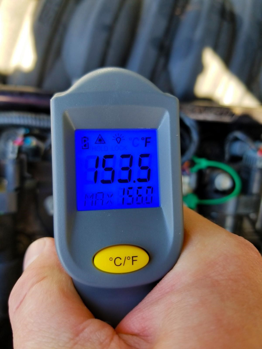 A digital thermometer reads 153.5 F.