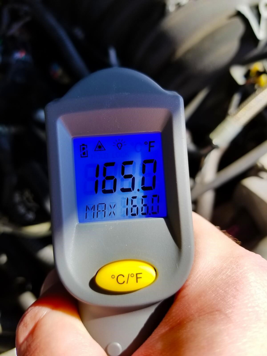 A digital thermometer reads 165.0 F.