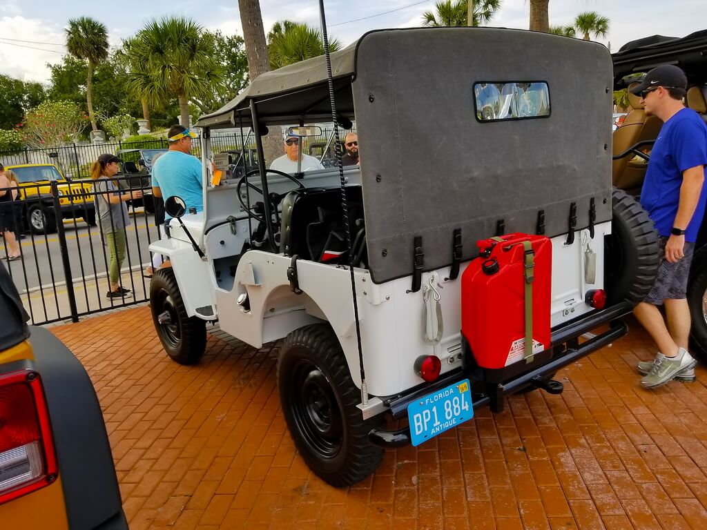 View of The Back of a Vintage White Jeep at a Car Show