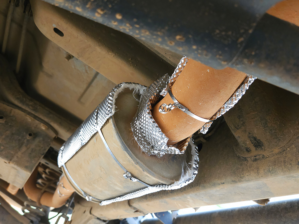 Heatshield Armor exhaust insulation installed on a Jeep Wrangler JK exhaust system including muffler