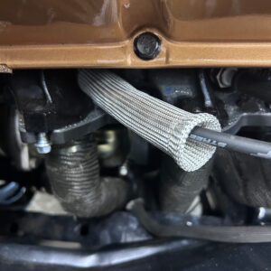 Natural fiber glass spark plug heat shield