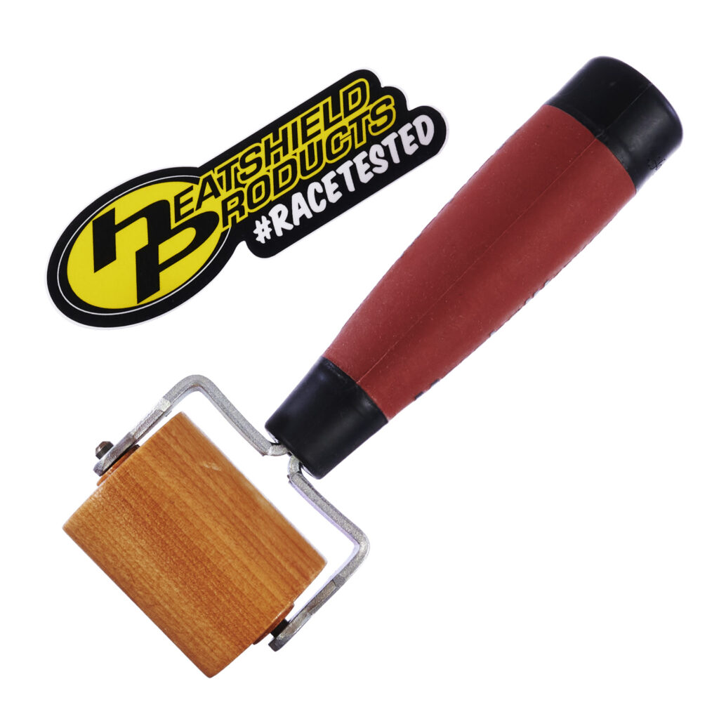 Professional-grade installation roller tool with red anti-slip handle and maple roller