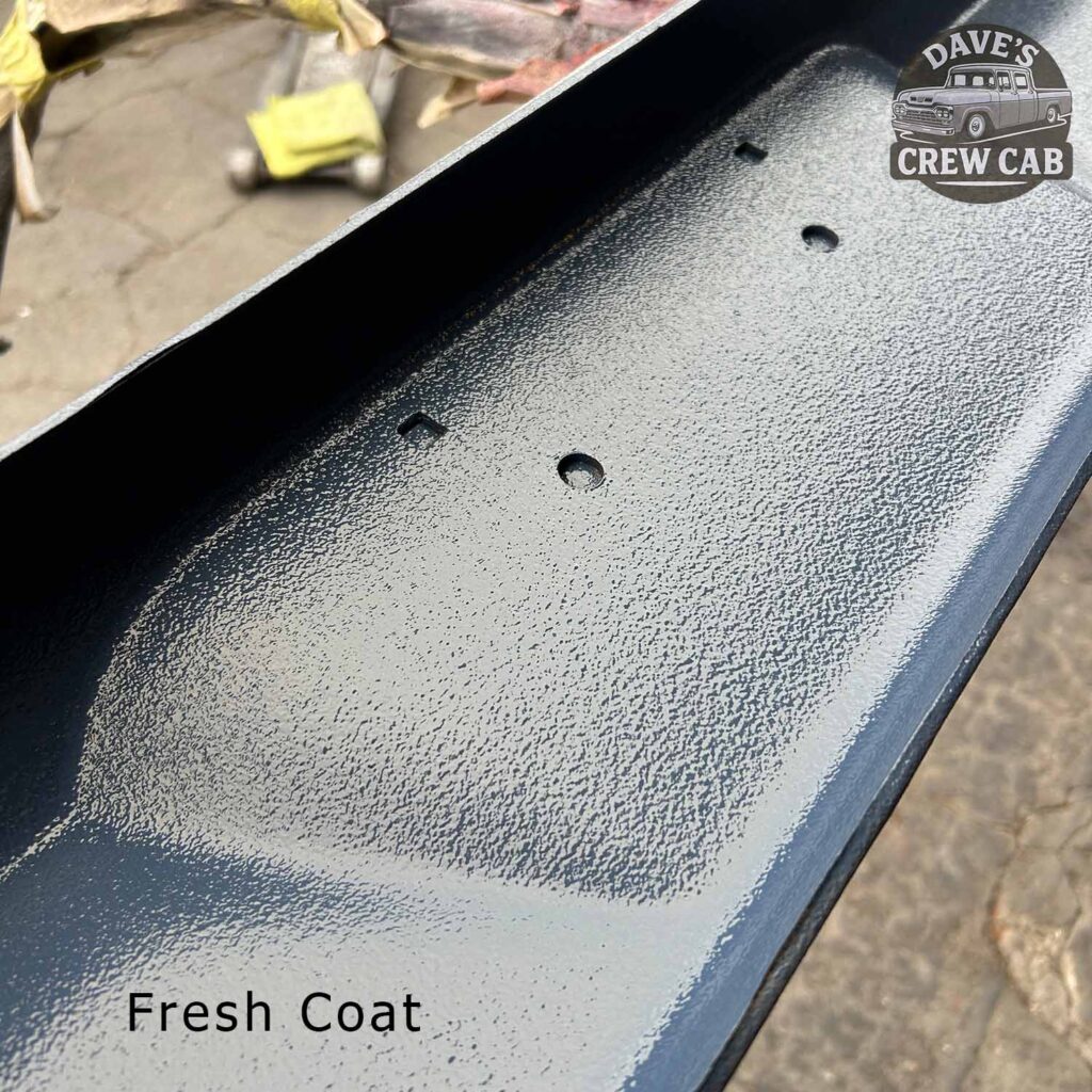 Close-up of a metal surface with a textured, freshly painted gray coating. The words Fresh Coat are in the bottom left, and the Daves Crew Cab logo is in the top right corner.